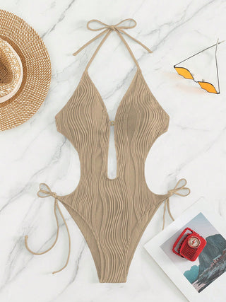 Shop Textured Cutout Tied One-Piece Swimwear Now On Klozey Store - Trendy U.S. Premium Women Apparel & Accessories And Be Up-To-Fashion!