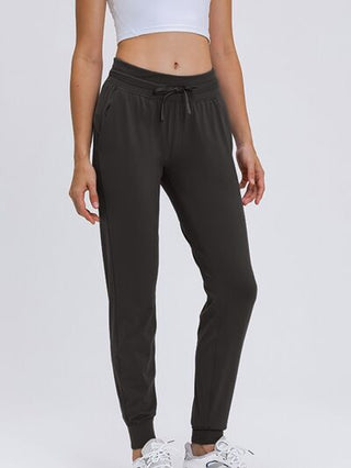 Shop Double Take Tied Joggers with Pockets Now On Klozey Store - Trendy U.S. Premium Women Apparel & Accessories And Be Up-To-Fashion!