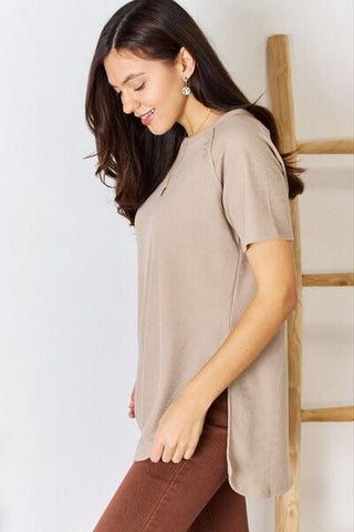 Shop Zenana Baby Waffle Short Sleeve Slit High-Low T-Shirt Now On Klozey Store - Trendy U.S. Premium Women Apparel & Accessories And Be Up-To-Fashion!