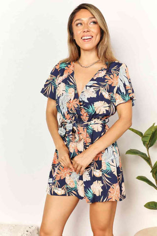 Shop Double Take Botanical Print Surplice Neck Tie Waist Romper Now On Klozey Store - Trendy U.S. Premium Women Apparel & Accessories And Be Up-To-Fashion!