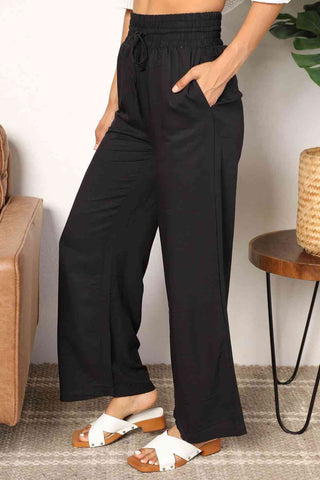 Shop Double Take Drawstring Smocked Waist Wide Leg Pants Now On Klozey Store - Trendy U.S. Premium Women Apparel & Accessories And Be Up-To-Fashion!